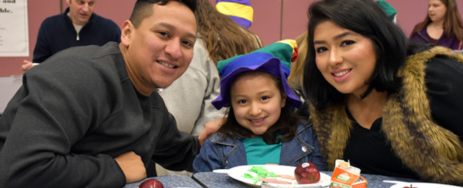Family enjoys breakfast together at Chinook Elementary School